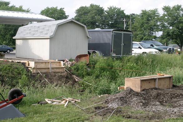 05-26-04 Construction begins on forms for concrete support base for footbridge