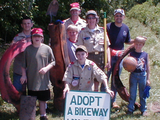 Grant Neimeyer, Matt Grigsby and Daniel Pritchard in the front; Cody Yost, Matt Pritchard, and Judy Grigsby in the second row; Scoutmaster Casey Elliott and Mike Pritchard are in the rear.