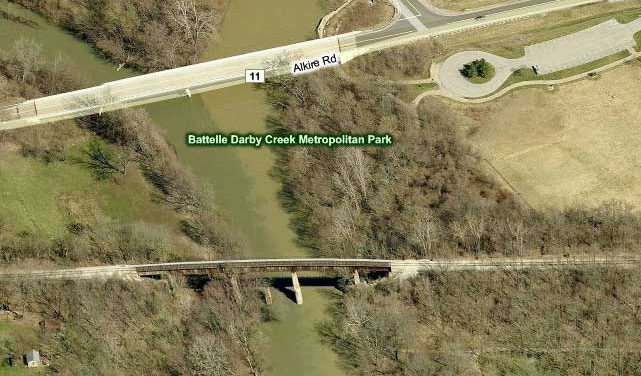 From the town of Georgesville East about .25 miles is the bridge over the Darby Creek.  The road bridge North of the trestle is the Alkire Road crossing, where a 'hanging' a pedestrian/bicycle bridge on the existing bridge has been planned.   (Photo: Bing.com)