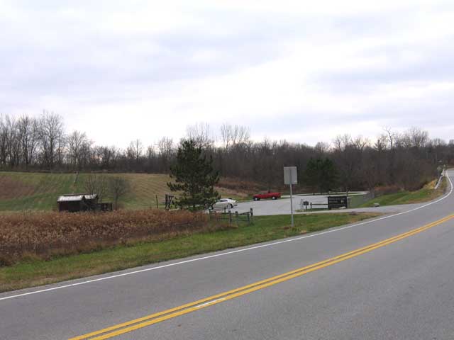 This parking lot for the Battelle Darby Creek Metro Park is at 8465 Alkire Road. The lot is circular and that's what shows on the Bing.com map above. From here the trail runs through the park. The bike trail is at the left of the picture (out of sight and not yet built) near the tree line.  There is about a .25 mile gap from the current end of the trail to the parking lot at Battelle Darby Creek MetroPark. (Photo: Richard Gehman)